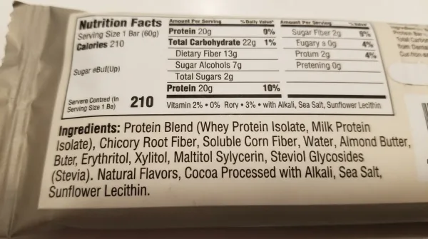 Close-up of a sugar-free keto bar ingredients label showing maltitol, xylitol, and erythritol